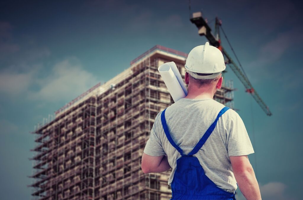 A construction contractor overlooking a building site.