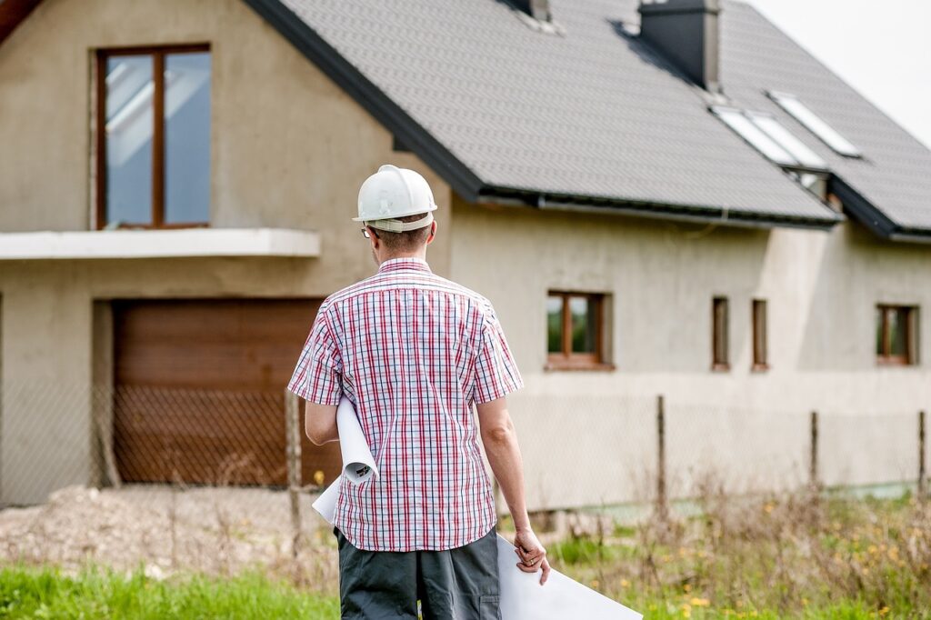 A construction manager observes a newly built house.