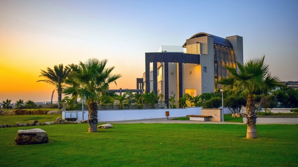 Office building with palm trees nearby