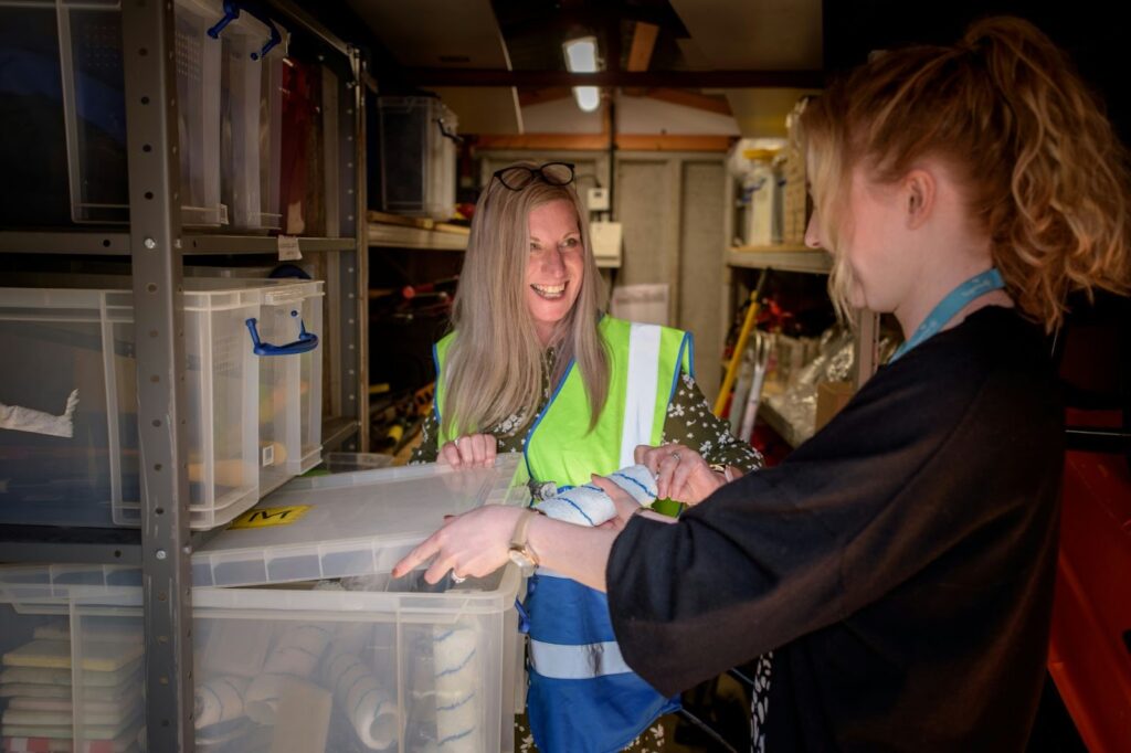 Two happy workers in a warehouse. 